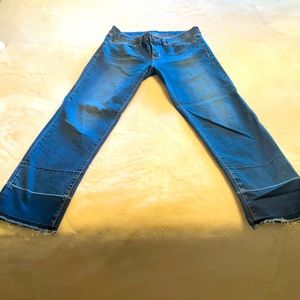 Size 4- medium blue, stovepipe jeans. Skinny fit. Fringed at the ankles.